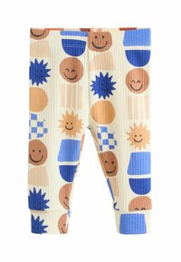 Krém színű bordázott anyagú leggings, amelyek vidám, mosolygó arcokat, geometriai formákat és különböző textúrákat ábrázoló színes mintákkal díszítettek, kék, narancs és barna színekben.