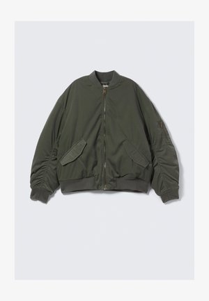 Olive green bomber jacket with front zipper, two flap pockets, ribbed collar, cuffs, waistband, and zippered pocket on left sleeve.