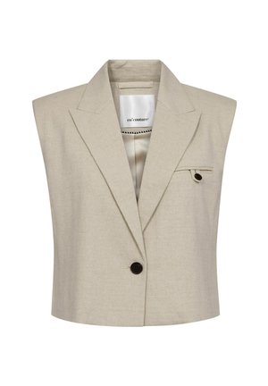 Bézs ujjatlan blézer széles hajtókával, egy sötét gombbal, és kis zsebbel bal oldalon, fedéllel.