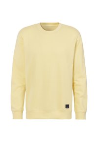 Sweatshirt en coton jaune à manches longues, col rond, poignets et ourlet côtelés, avec un petit patch logo noir sur le bas devant.