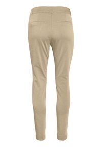 Beige, tailored pants made from a smooth fabric, featuring back pockets and a fitted design with cuffed hems.