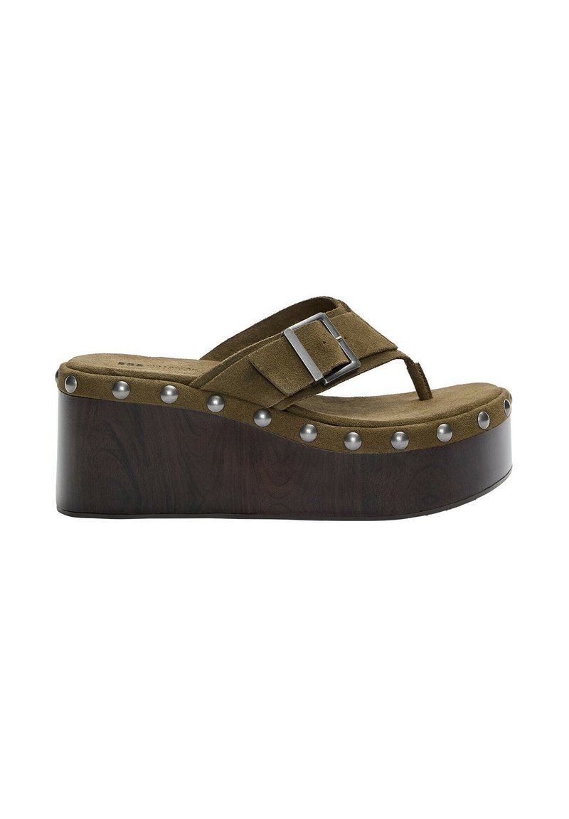 Green suede platform sandals with a wooden base, decorative silver studs along the edge, and an adjustable buckle strap.