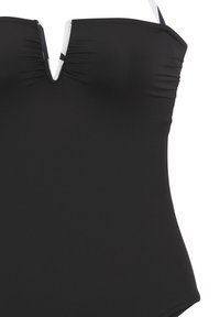 Schwarzes Schwimmanzug aus strukturiertem Stoff, mit V-Ausschnitt und gerafften Details. Das Design ist schlicht, mit dünnen verstellbaren Trägern.