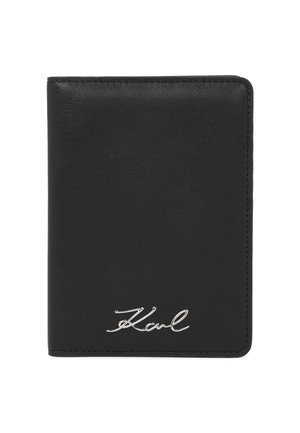 Black leather bifold wallet with smooth texture and silver "Karl" signature on front lower right corner.