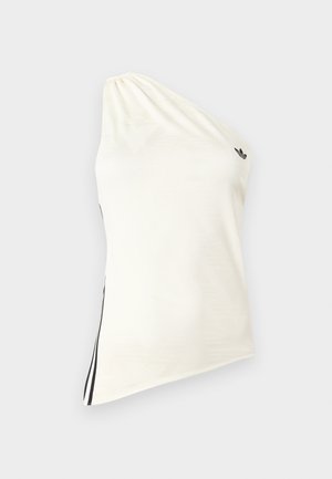 Τοπ με έναν ώμο σε κρεμ ύφασμα, με ελαφριά γυαλάδα, αντίθετες μαύρες ρίγες στο πλάι και μικρό μαύρο λογότυπο στον ώμο.