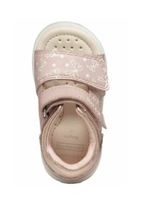Rosa sandaler med et blomstermønster og prikker, med en velcrorem, en perforeret tåboks og en beige polstret indersål.