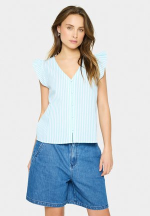 Light blue striped blouse with a V-neck, short ruffled sleeves, and front buttons, paired with denim shorts for a casual look.
