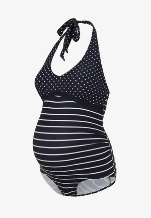 Maiô de maternidade em azul-marinho com bolinhas brancas na parte de cima e riscas horizontais na parte de baixo. Apresenta alças de pescoço estilo halter e tecido elástico.