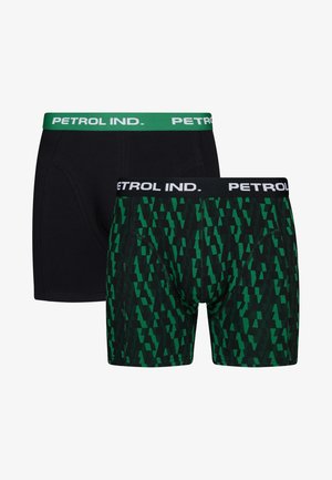 Dva páry pánských boxerky: jedny v čistě černé barvě, druhé zelené s geometrickým vzorem, přičemž mají kontrastní značkové pásky.
