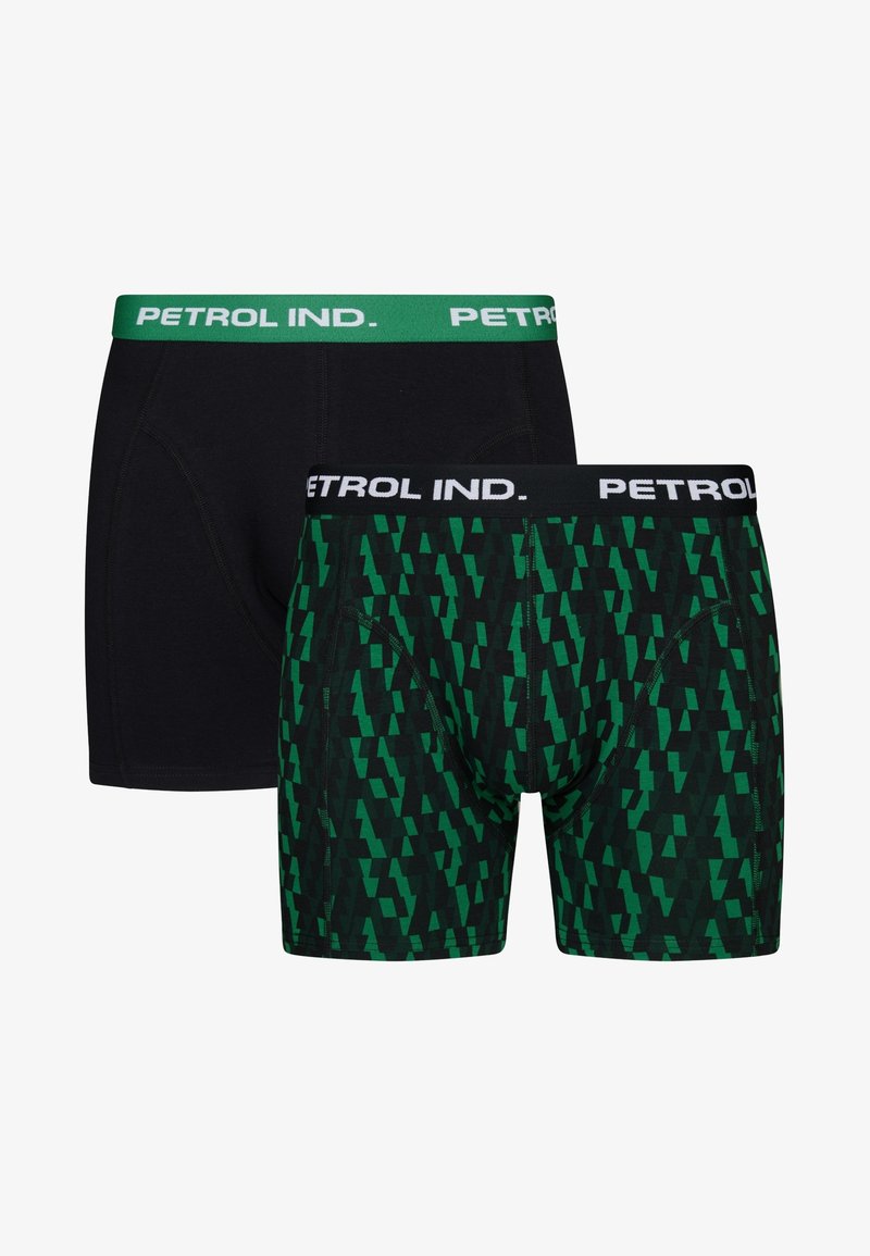 Två par herrboxer: ett par helt svart, och ett par grönt med geometriskt mönster, som har kontrasterande varumärkesmidjeband.