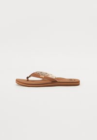 Brown flip-flop with a textured brown sole, featuring tan straps with a patterned inner lining and a small logo on the footbed.