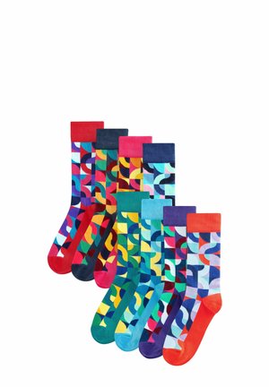 Bunte Baumwollsocken mit geometrischen Mustern in verschiedenen Farbtönen, mit gerippten Bündchen in kontrastierenden Farben. Neun Paar ausgestellt.