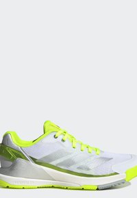 White and neon yellow athletic shoe with mesh upper, neon laces, and textured sole, shown from the side on a plain background.