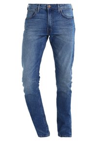 Skinny blue jeans made of denim, featuring a five-pocket design, with a smooth texture and light fading around the thighs.