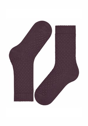 Chaussettes en coton bordeaux avec un motif texturé et des bordures côtelées. Elles présentent une finition lisse et une forme standard adaptée au port quotidien.