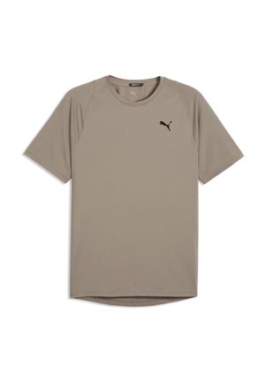 Beige Puma sportshirt met korte mouwen, ronde hals en zwart Puma-logo op de borst tegen een witte achtergrond.