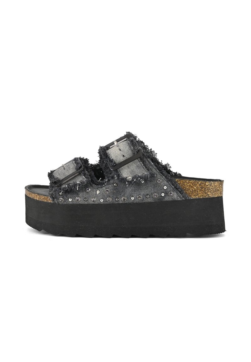 Black platform sandals with frayed denim straps, featuring two adjustable buckles and embellished with silver studs along the side.