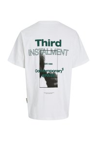 White cotton t-shirt featuring a graphic print in green and black. Text includes "Third Instalment," "EST. 1990," and "Contemporary Space."
