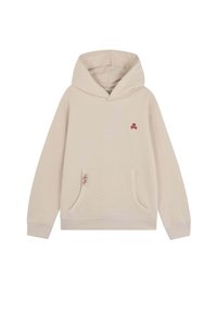 Sudadera beige clara con bolsillo frontal, pequeño logo de calavera y huesos rojos en el pecho, y etiqueta "Speaks" en el borde del bolsillo.