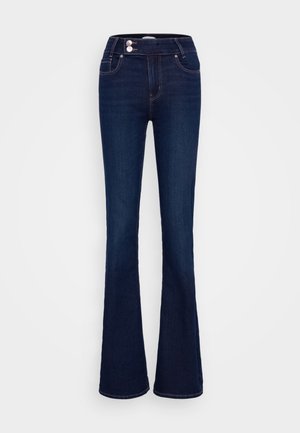 Jean bleu foncé évasé avec une taille haute, deux poches avant et deux fermetures à bouton. Fabriqué en denim avec une texture lisse.
