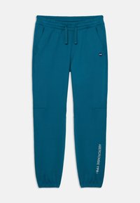 Teal sweatpants with an elastic waist, drawstring, side pockets, and cuffed hems. Features logo print on the left leg. Smooth texture.