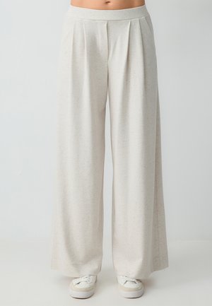 Brede broek in lichtbeige, gemaakt van zachte stof met een subtiele textuur. Heeft een geplooide voorkant en een bijpassende elastische tailleband.