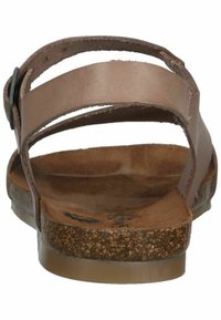Braune Leder-Sandalen mit zwei breiten Riemen und einer Kork-Fußbettung. Sie verfügen über eine flache Sohle und eine einfache Metallschnalle zur Anpassung.