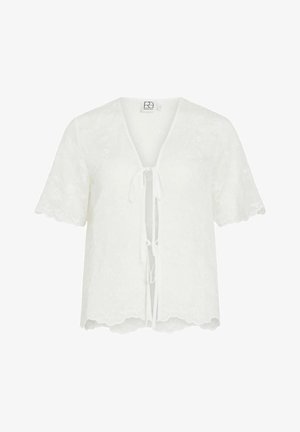 Blouse blanche à manches courtes avec broderie florale, bords festonnés, col en V et fermetures à nouer à l'avant.