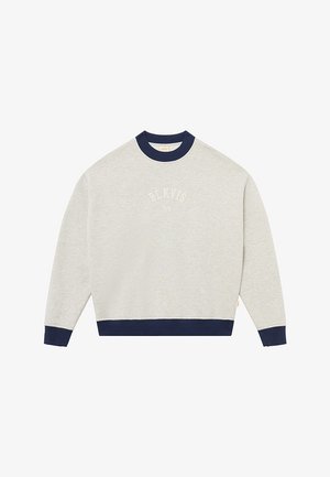 Light grey sweatshirt with a navy ribbed collar and cuffs. Features the text “BLKVLS NY” in white arching at the chest.