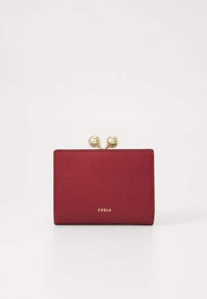 Red leather wallet with a smooth texture, featuring a gold clasp closure and "Furla" logo embossed in gold on the front.