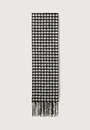 Black and white checked scarf made of soft fabric, featuring a fringe along the edge and a boxy pattern throughout.