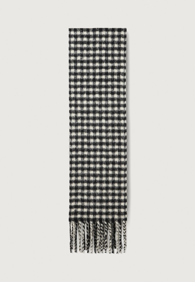 Cachecol em preto e branco com padrão quadriculado, feito de tecido suave, apresentando uma franjas ao longo da borda e um padrão retangular por toda a peça.