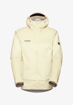 Beżowa wodoodporna kurtka z kapturem, pełnym zamkiem z przodu, regulowanymi mankietami, logo "Mammut" na piersi oraz emblematem mamuta na lewym rękawie.
