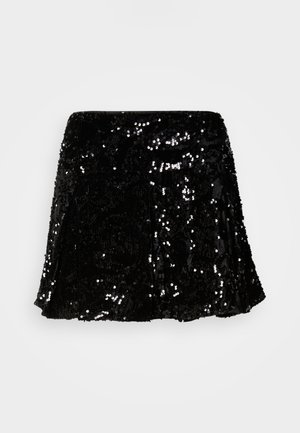 Jupe noire en sequins affichant un design évasé, une texture scintillante, et un ourlet qui tombe au-dessus du genou. Ceinture lisse pour un confort optimal.