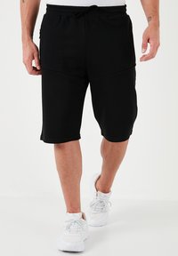 REGULAR FIT - Treningo apatinė dalis - black