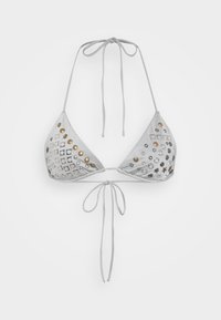 White triangle bikini top featuring cut-out designs, metallic hardware accents in gold and silver, and adjustable ties for fit.