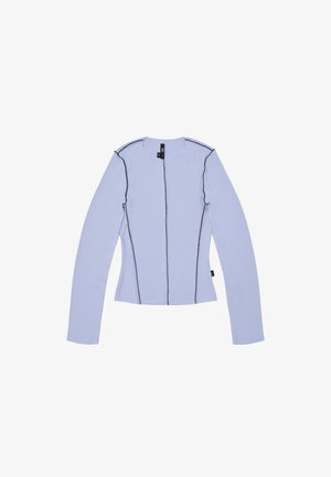 Light blue long-sleeve top with a ribbed texture, featuring black stitching along the seams and a round neckline. Zip closure at front.