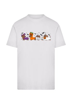 White short-sleeve T-shirt featuring cartoon dogs in costumes: a witch, pumpkin, mummy, and ghost, with black bats and stars.