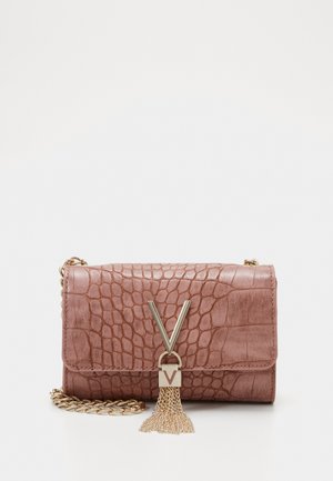 Pink faux leather handbag with crocodile texture, gold hardware, V-shaped accent, and a chain strap. Features a tassel detail.