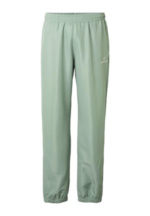 Lichtgroene sweatpants met elastische taille en enkels, voorzien van een klein wit logo op de rechterdij, gemaakt van gladde stof.