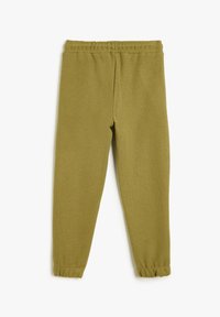 Olijfgroene katoenen joggingsbroek met een elastische tailleband en gathered cuffs bij de enkels, met een zachte, gestructureerde afwerking.