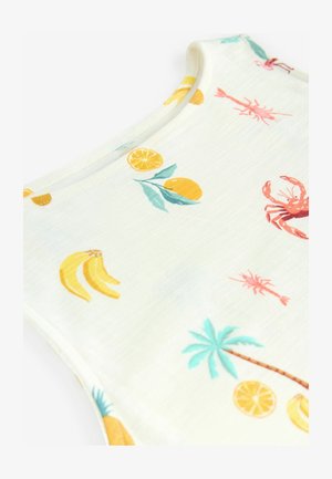 Valkoinen kangastoppi, jossa on värikäs printti sitrushedelmistä, rapuista ja palmupuista. Pehmeä pinta ja pyöreä kaula-aukko.