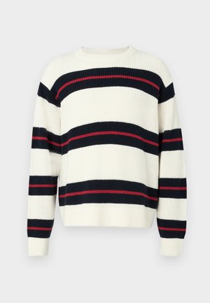 Gestreifter Pullover in Creme, mit marineblauen und roten horizontalen Streifen. Aus dickem Strickmaterial gefertigt, mit langen Ärmeln und Rundhalsausschnitt.