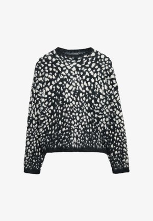 Pull à mailles noires avec une texture duveteuse, orné de taches abstraites blanches. Col rond, manches longues et coupe courte.