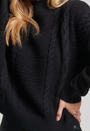 Stickad tröja - black