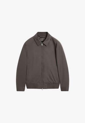 Veste légère marron avec une coupe décontractée, dotée d'un col rabattu, d'une fermeture éclair à l'avant, de deux poches latérales, et de poignets et d'un ourlet côtelés.