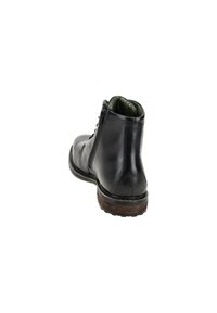 Schwarze Leder-Ankle-Boots mit strukturiertem Innenfutter, Schnürverschluss, seitlichem Reißverschluss und einer braunen Gummisohle für besseren Halt.