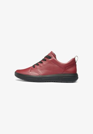 Red leather sneaker with black laces, rounded toe, and a textured black rubber sole. Features a pull tab on the heel for easy wear.