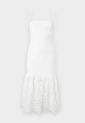 Λευκό midi φόρεμα χωρίς μανίκια με λουλουδάτες τρύπες (eyelet), λεπτές τιράντες που δένουν στους ώμους, εφαρμοστό μπούστο και φαρδύ βολάν στο τελείωμα.