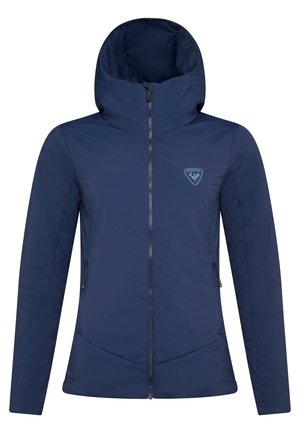 Marineblauwe, ritsjack met capuchon, gemaakt van soepel materiaal. Voorzien van een zijzak en een logopatch op de linkerborst. Gevoerde uitvoering.